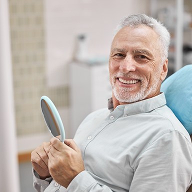 patient smiling after getting dental implants in Thornville