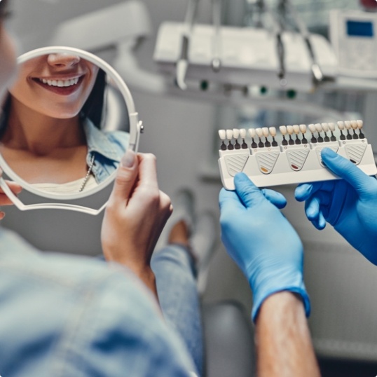 Woman talking to dentist about dentistry treatment options