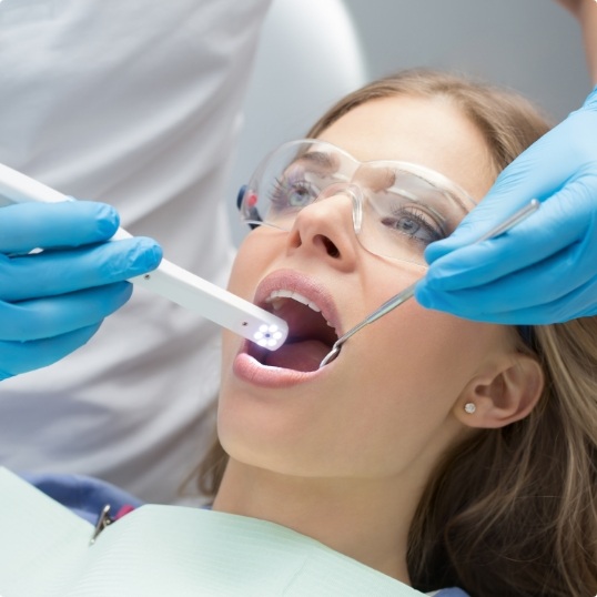 Dentist using intraoral camera to capture smile images