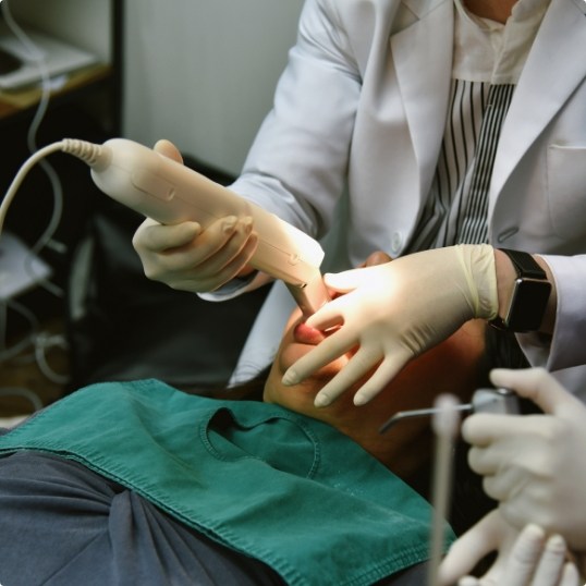 Dentist using digital impressions system