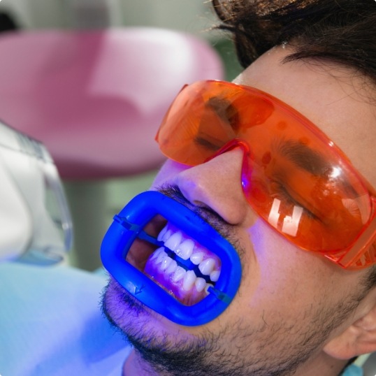 Dental patient receiving professional teeth whitening