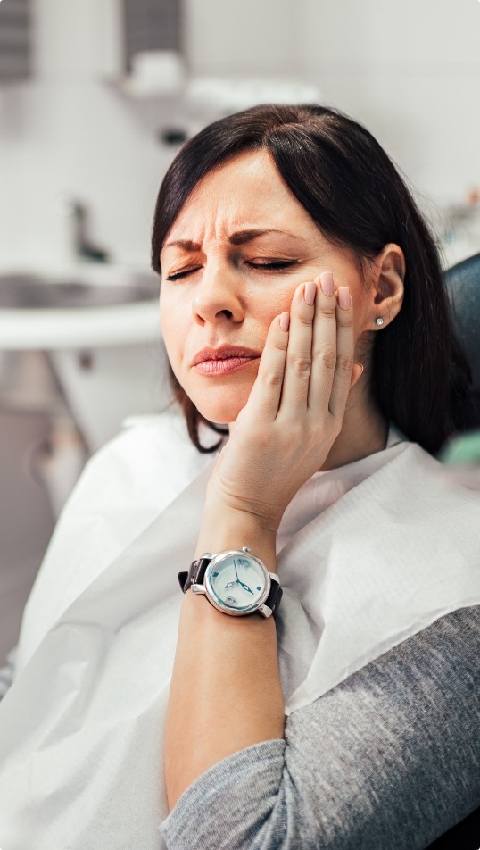 Woman in pain before emergency dentistry