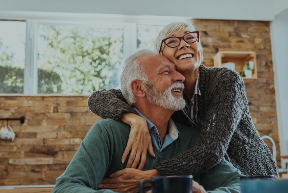 Man and woman with healthy smiles after visiting the top rated dentist in Thornville Ohio