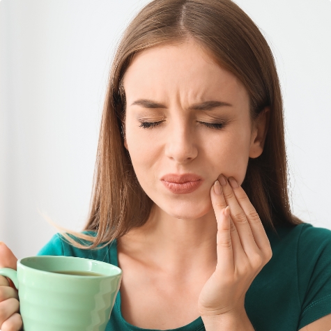 Woman in pain before emergency dentistry