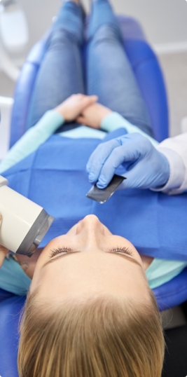 Woman receiving dental treatment