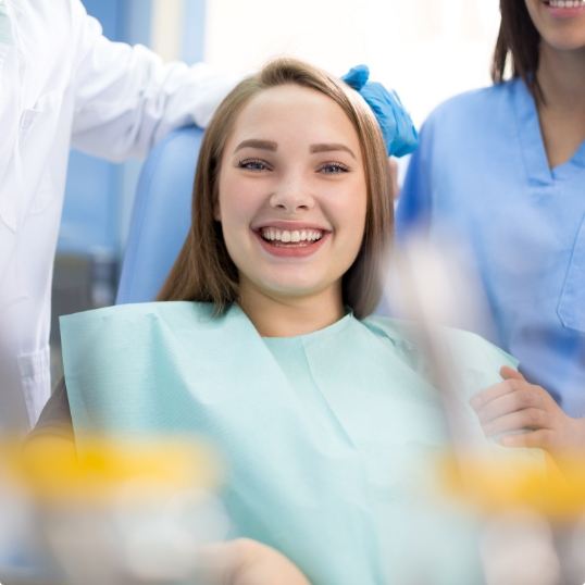 Man discussing how dental insurance works with dentist