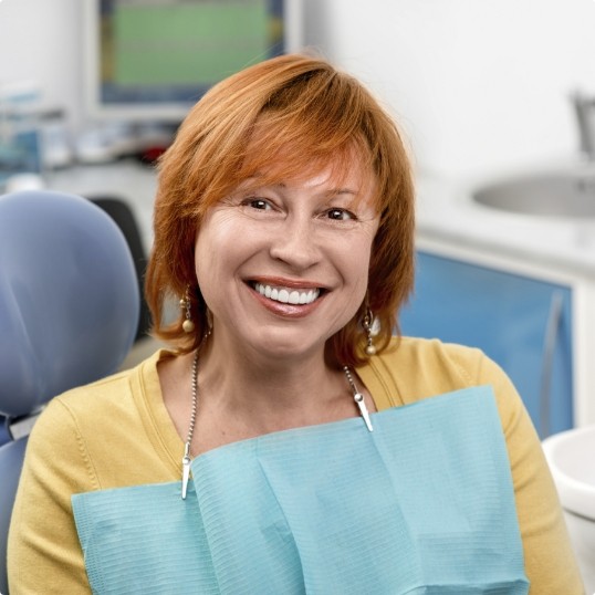 Woman sharing healthy smile after preventive dentistry checkup and teeth cleaning visit