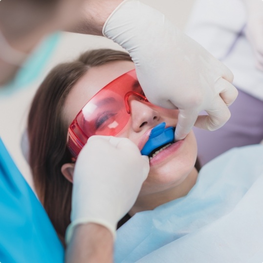 Dental patient receiving fluoride treatment