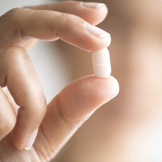 Hand holding an oral conscious sedation dentistry pill