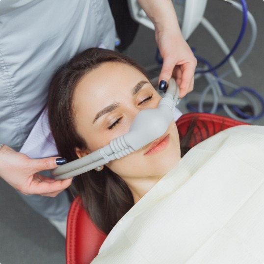 Woman receiving nitrous oxide sedation dentistry